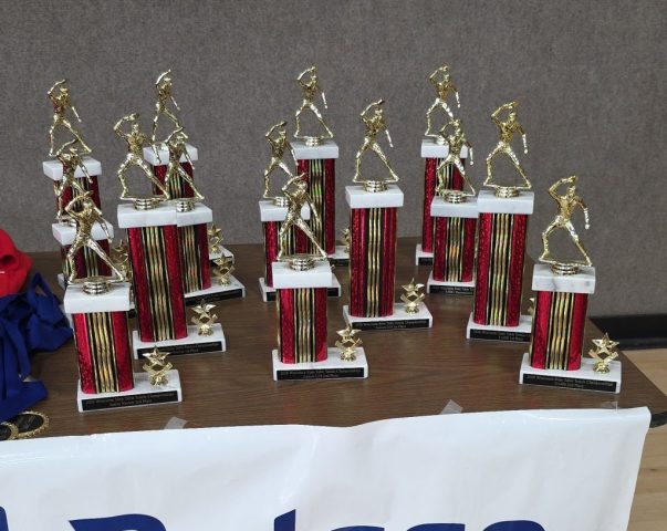 Wisconsin State Championships trophies on table April 2026